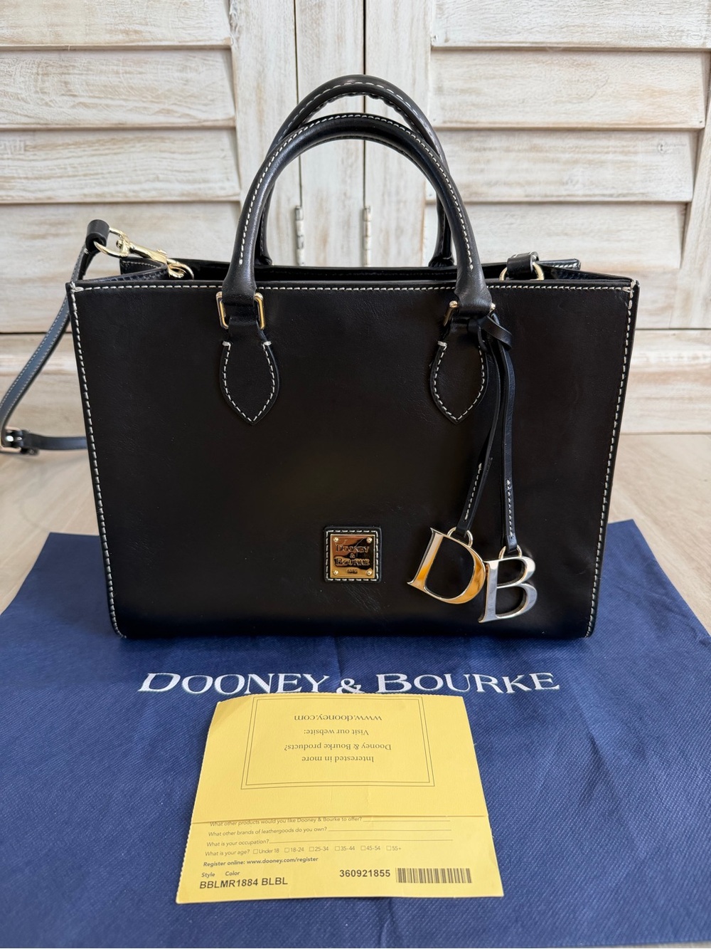 Dooney & Bourke Navy Leather Satchel with DB Charm